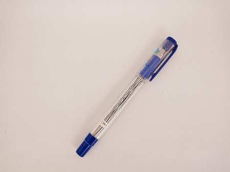 blue ballpoint pen in photo on white background. Used for students, office employees to writeの写真素材