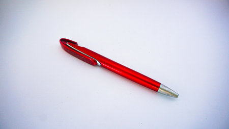 Red pen isolated on white backgroundの写真素材