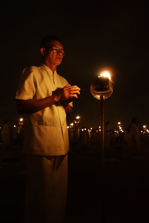 Buddhist Pray with ground lanternのeditorial素材