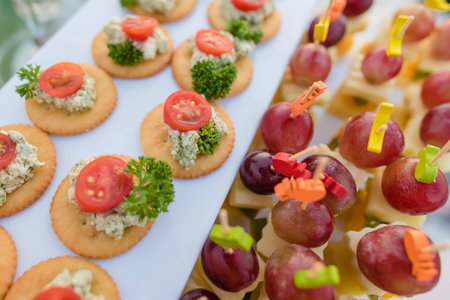 Appetizer canapes with tuna on with plate in party.の写真素材
