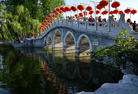 Ancient bridge full with tourists and red lanternsのeditorial素材