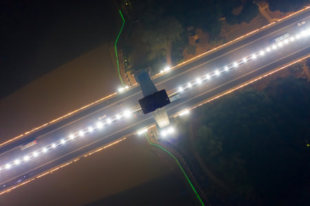 Aerial photography of night view of Sanxianzhou Bridge (a cable-stayed bridge across the river) in...