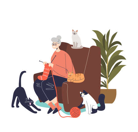 Cute cartoon grandmother knitting sit in comfortable armchair with cats around. Senior lady hobbyのイラスト素材