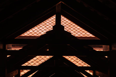A silhouette of Thai traditional orange color ceramic tile style