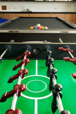 Closeup of soccer table with pool table