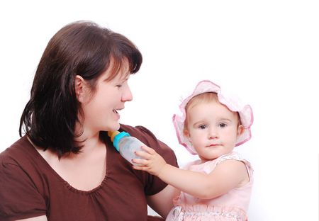 Mom is feeding her baby and vice versaの写真素材