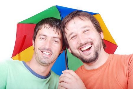 Two funny men are laughing under umbrellaの写真素材
