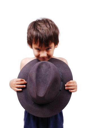 Cute boy hiding behing black hatの写真素材