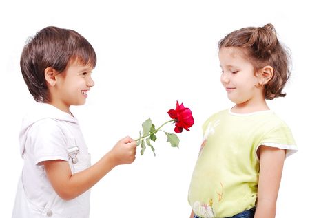 Very cute scene of two little children with roseの写真素材