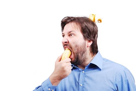 Young man blowing up his brain with bananaの写真素材