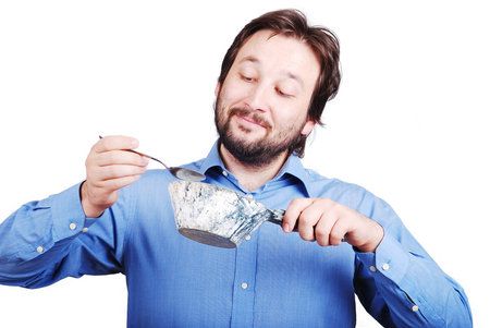 Young male model is about to eat cementの写真素材