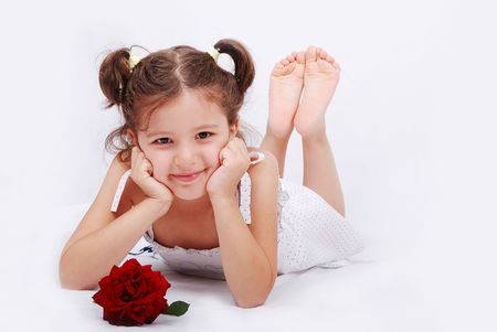 Beautiful scene of a girl laying on groundの写真素材