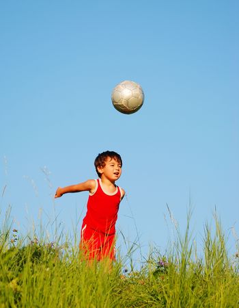 Happy little child playing in natureの写真素材