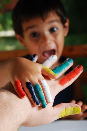 Several colors on children fingers, outdoorの写真素材