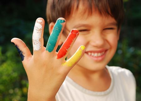 Several colors on children fingers, outdoorの写真素材