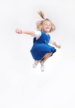 Happy child is jumping high, isolatedの写真素材