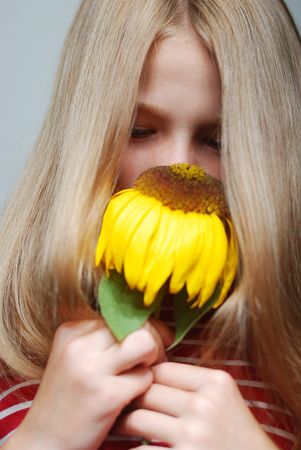 Melancholy on scene, cute girl with dry sunflowerの写真素材