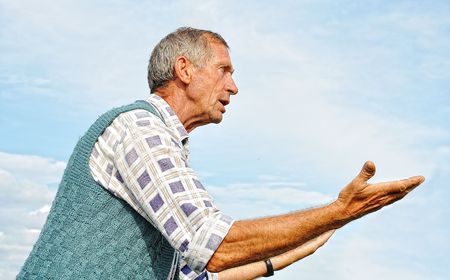 Middle aged male person with interesting gesturesの写真素材