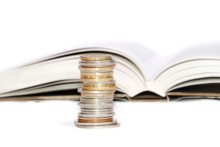 Coins details on the  isolated white background and bookの写真素材
