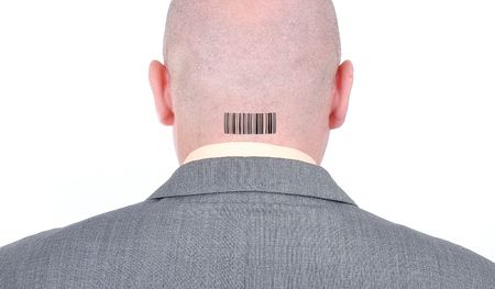Young bald businessman from his backの写真素材