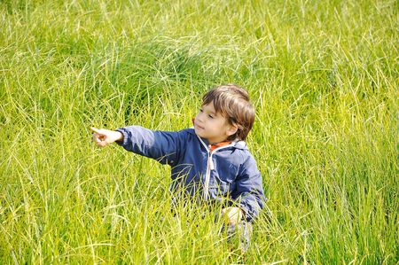 Happy childhood on green beautiful meadowの写真素材