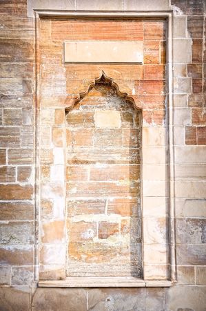 Shape of gate in rock, brick wall backgroundの写真素材
