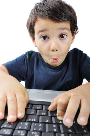 A little cute kid with a laptop isolatedの写真素材