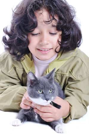 Very cute child with a cat in armsの写真素材