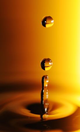 Water drop in orange and blackの写真素材