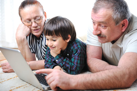 elderly couple with laptop