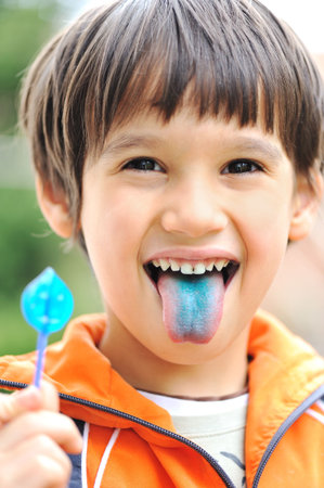 Fun, candy on tongueの写真素材