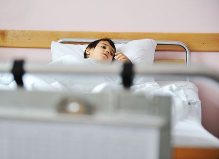 Ill child in hospitalの写真素材