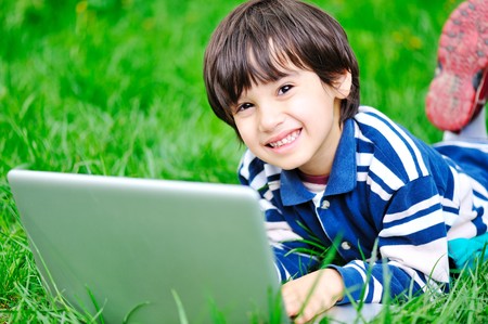 Children activity with laptop in natureの写真素材