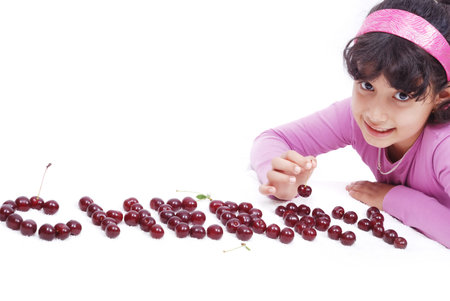 kid with cherryの写真素材