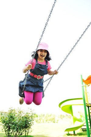 On the playground, swingingの写真素材