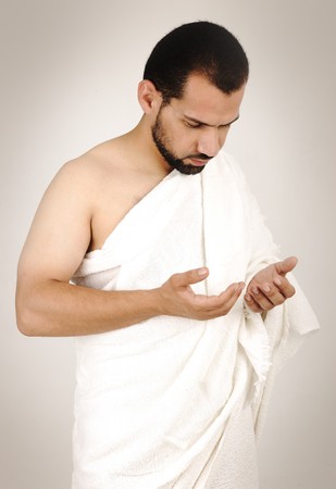 muslim pilgrim in white traditional clothesの写真素材