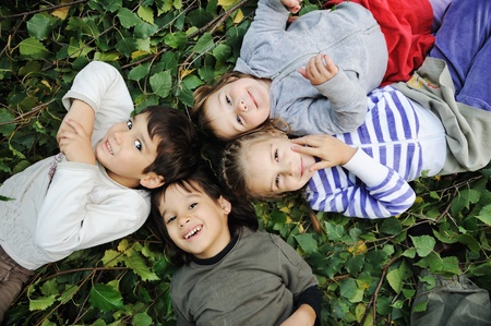 Children on ground, in natureの写真素材