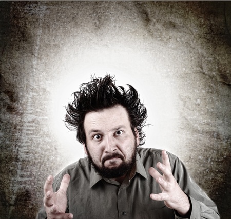 Young male model with funny hair with expression on faceの写真素材