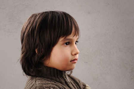 One kid - many faces, series of clever schoolboy 6-7 years old with facial expressionsの写真素材