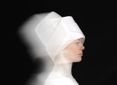 Artistic motion photo of white sufy female dancersの写真素材