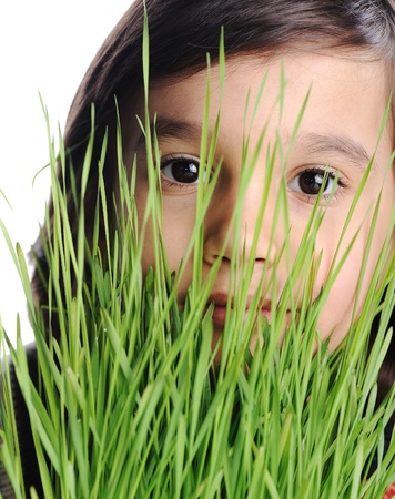 Child and grass closeup, conceptの写真素材