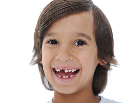 Lost milk tooth fairy, cute boy with long hairの写真素材