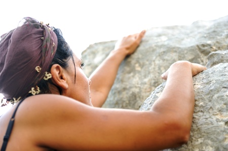 Female climbing rock on the mountainの写真素材