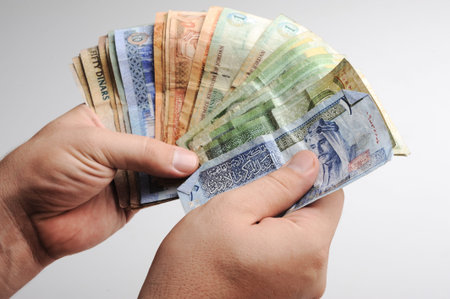 Counting arabic money in hands