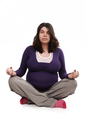 Pregnant woman meditatingの写真素材