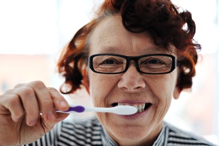 Senior woman brushing teethの写真素材