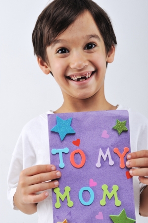 Kid holding message for lovely Momの写真素材