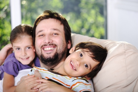 Father son and daughter at homeの写真素材