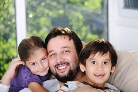 Father son and daughter at homeの写真素材