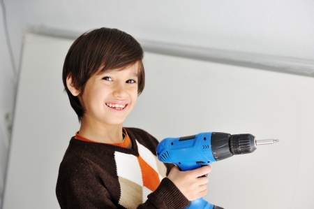 Kid with drill toolの写真素材